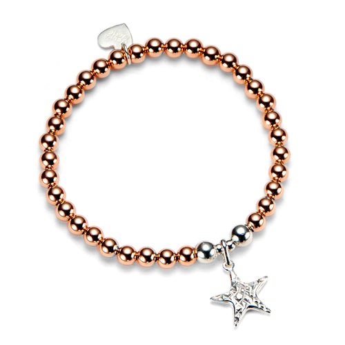 rose gold beaded stacking bracelet with sterling silver focal beads and star charm